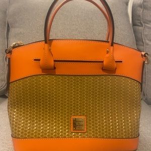 Dooney & Bourke zip top domed leather satchel with detachable leather strap.